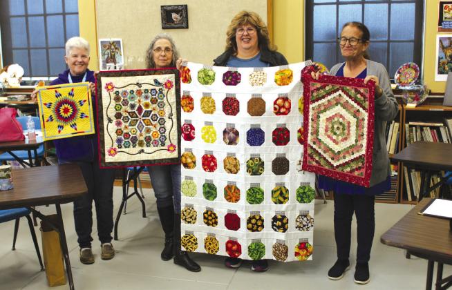 Nathan Diebenow | Meridian Tribune Members of the Quilt Guild show off their hand-made quilts during their regular meeting at the Bosque Arts Center in Clifton in February 2024.