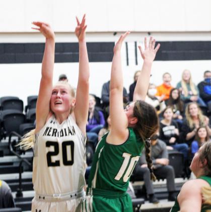 Forrest Murphy/Meridian Tribune/Meridian freshman Evelyn Dirkse (20) and the Lady Jackets fell to the Hamilton Lady Bulldogs, 68-9 Tuesday night.