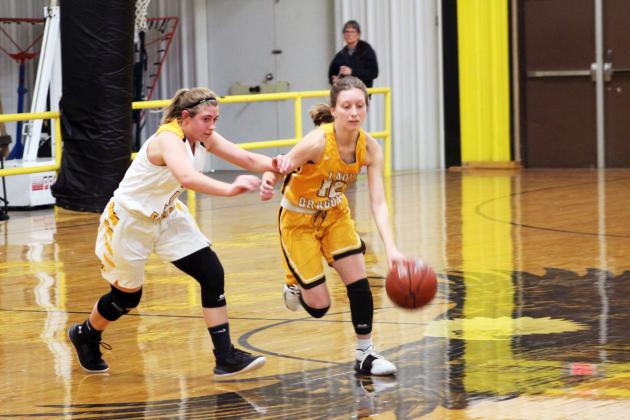 Forrest Murphy/Meridian Tribune/Iredell senior Emily Wellborn (12) and the Lady Dragons punched their ticket to the Class 1A regional semifinals after defeating the Lingleville Lady Cardinals, 46-44 in the teams’ regional quarterfinals bout Tuesday night in Stephenville.