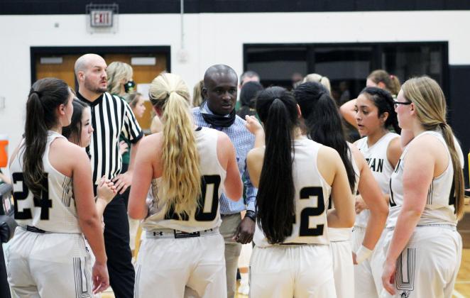 Forrest Murphy/Meridian Tribune/In a recent interview, Meridian Head Girls’ Basketball Coach Joshua Reese, center, answered questions about his playing days, as well as his time leading the Lady Jackets. 