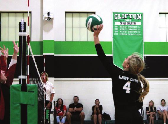 Junior Carley Caniford fakes a spike and gets the point with a soft set just over the net. Brook DeZavala | The Clifton Record