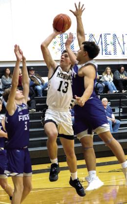 Meridian senior Camron Sheffer (13) puts up a driving jump shot against the Frost Polar Bears (above); Jacket head coach Grant Schur during a timeout (above left). Photo by Wendy Orozco courtesy of Brett Voss’ The Sports Buzz