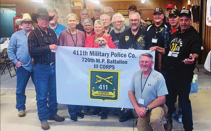 C.R. (kneeling in front) and Gale Sinderud hosted a veterans reunion from the 411th Military Police unit in Clifton last week. The veterans served in the unit between 1972 and 1976. Photo Courtesy Gale Sinderud