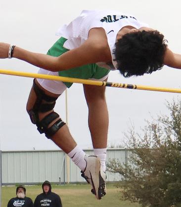 Clifton senior Andres Devora clears the high jump bar to take the bronze medal in Troy (above); Lady Cub freshman Natalia Cathcart wins long jump and high jump (left). Photos courtesy Madison Otter, Clifton High School Yearbook Staff