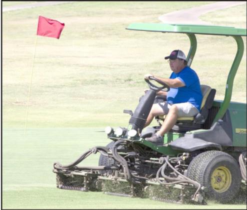Allen D. Fisher | Meridian Tribune Bosque Valley Golf Club course grounds keeper and area golf coach Harvey Welch mows the course Sunday.