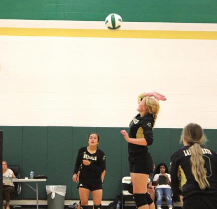 Lady Jackets go up for an attempt to spike the ball over the net during their match against Whitney at the Valley Mills Tournament last weekend. Brook DeZavala | Meridian Tribune