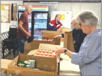 Volunteers with North Bosque Helping Hands Food Pantry filled 99 Christmas gift baskets with food items for families participating in the area Angel Tree program on Friday, December 15, 2023. Courtesy Photo by North Bosque Helping Hands