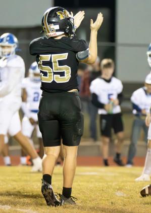 Yellowjacket senior Austin Pogue (55) celebrates the defensive effort against Frost in the finale last Friday night. Photo by Wendy Orozco courtesy of Brett Voss’ The Sports Buzz