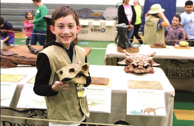 Clifton Elementary School fifth grader Gabe Prusha is an ambassador for Dinosaur George, helping other students and parents learn about dinosaurs and fossils during Clifton Elementary School’s open house event. Ashley Barner | The Clifton Record
