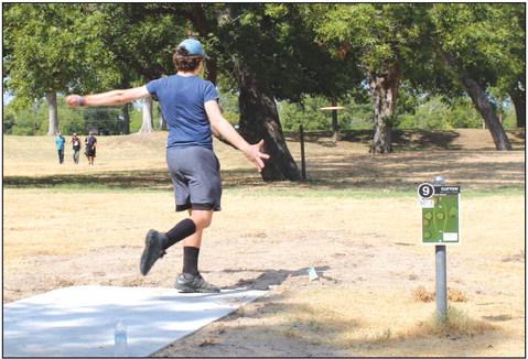 Jacob Grelle launches a disc on bucket nine of the 18 bucket disc golf course in Clifton City Park during the first-ever disc golf tournament in Clifton on Saturday, September 2. Nathan Diebenow | The Clifton Record