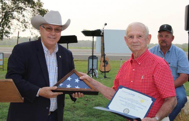 Top, Field Agent for Congressman Roger Willams, Don Nicolas, presented Mayor Johnnie Hauerland and the city of Meridian with a flag and certificate commemorating the dedication of the John A. Lomax Amphitheater. Ashley Barner The Meridian Tribune