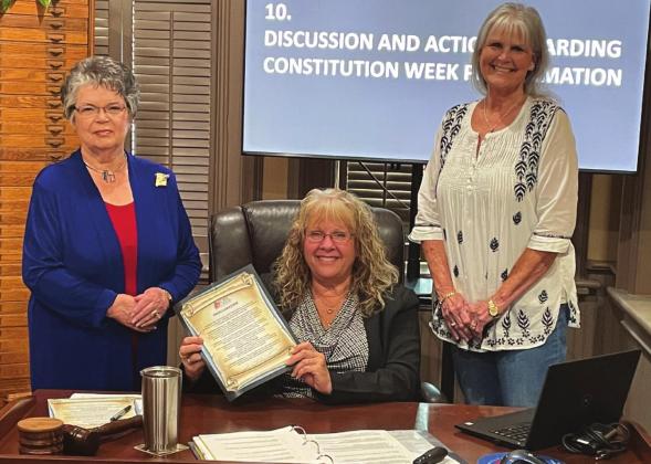 Bosque County Judge Cindy Vanlandingham signs proclamation for observance of Constitution Week, September 17-23, in Bosque County. Pictured with Judge Vanlandingham are Bosque River Valley DAR Chapter Regent Sue Fielden and Chapter Officer &amp; Board Member Carla Sigler. Courtesy Photo