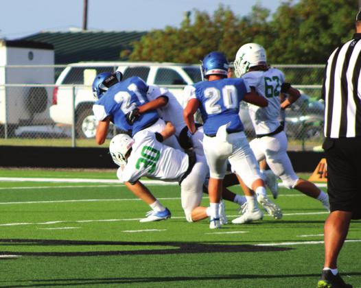 Below, Cubs defense thwarts Blooming Grove’s attempt to run the ball up the field after running a set of plays during their scrimmage Friday evening.