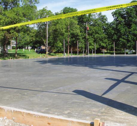 The concrete slab was poured at the Chisholm Trail Plaza in Meridian. Located at the site of the old county jail, the work on the plaza is expected to be complete by the end of the summer. Ashley Barner | Meridian Tribune