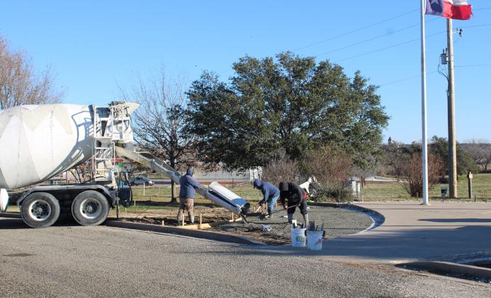 A crew from Hillsboro-based Five-Star Concrete on Friday, December 29, 2023, laid concrete at the site of the Bosque County Veterans Memorial in Meridian. Pictured are (from left) Marcos Juarez, Zeke Montes, and Juan DeLuna. Nathan Diebenow | The Clifton Record