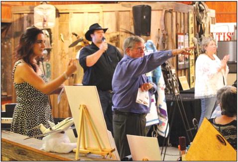 Volunteers Rebecca Clift (from left), Steve Olsen, Lance Parker, and Trudy Sheffield ran the live auction during Bosque Spay Neuter’s third annual Fabulous Fandango fundraiser at Texas Safari on Saturday, September 23. Nathan Diebenow | The Clifton Record