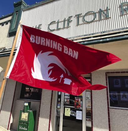 Outside the office of The Clifton Record and Meridian Tribune in historic downtown Clifton flies a flag reminding residents that Bosque County’s burn ban is in effect. Nathan Diebenow | The Clifton Record