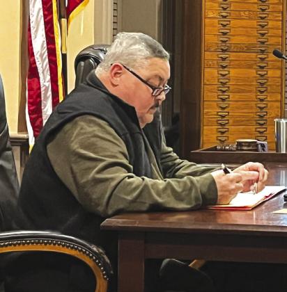 Bosque County Commissioner Billy Hall reviews the agenda prior to a recent Bosque County Commissioners Court meeting in Meridian. Nathan Diebenow | The Clifton Record