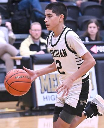 Jacket freshman Josh Nunez l(12) ed Meridian in scoring to be named the All-District 20-1A Newcomer of the Year (left); junior Matty Jones (10) and freshman Guillermo Ortiz (2) were first-team, all-district selections. Photos courtesy of Brett Voss’ The Sports Buzz